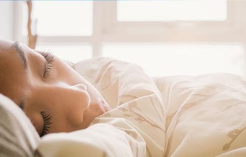 woman and man looking at pregnancy test smiling