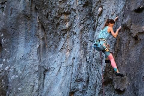 female rock climber on a rock