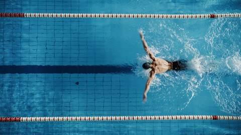 swimmer in a pool viewed from above